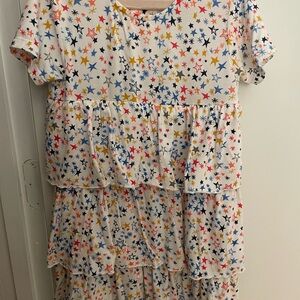 Magnetic me girls dress with stars design.